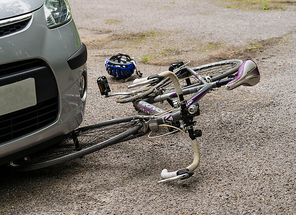Bike under car during road traffic accident